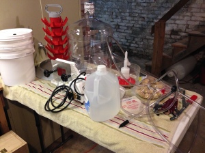 It's Riesling bottling day!  On this table is all the bottling equipment from the racking cane to Buon Vino filter, bottle tree, and sanitizer.